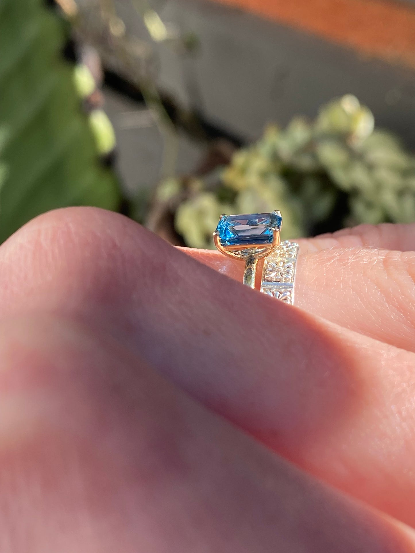 EMERALD CUT BLUE TOPAZ SOLITAIRE RING