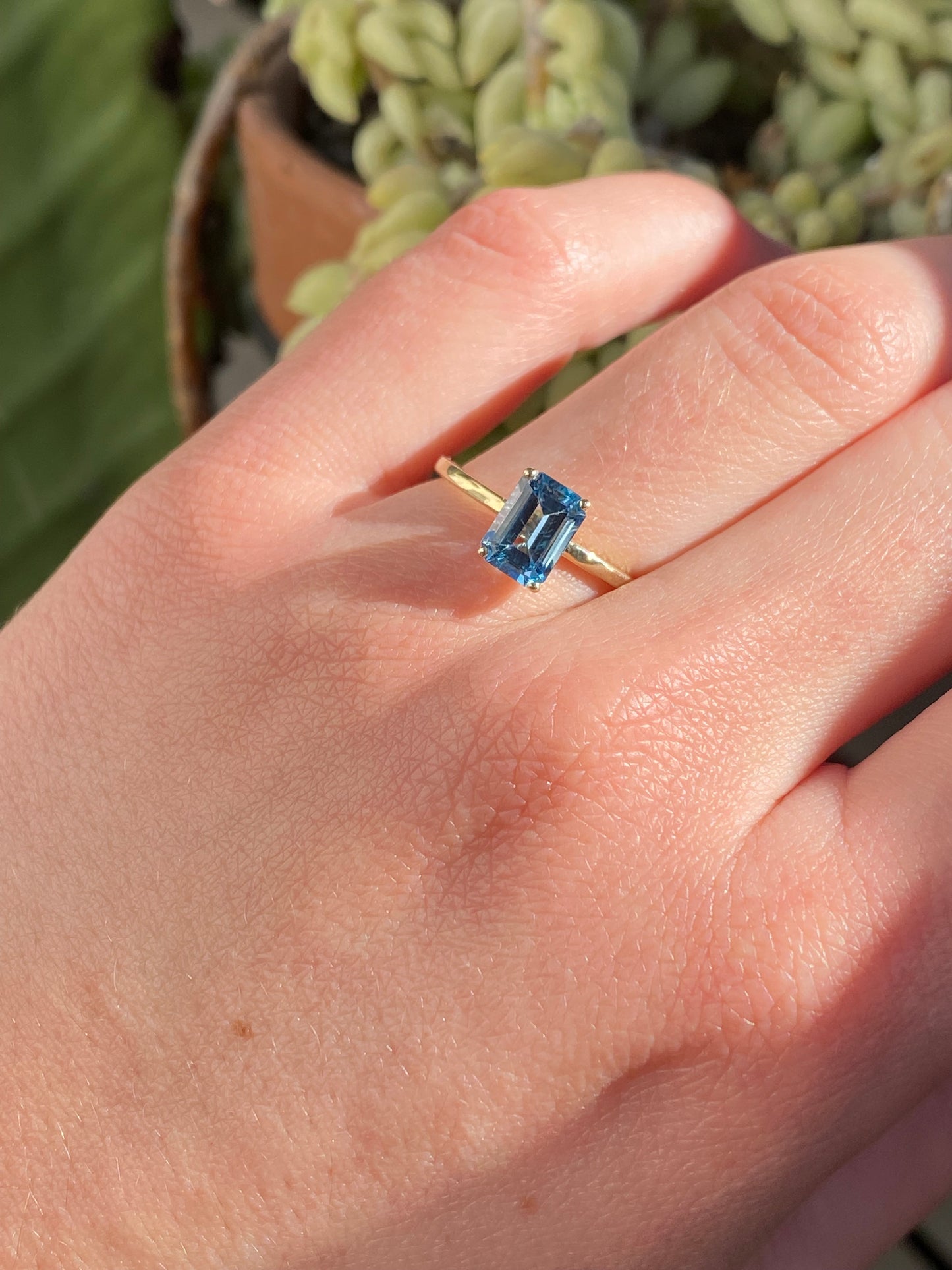 EMERALD CUT BLUE TOPAZ SOLITAIRE RING