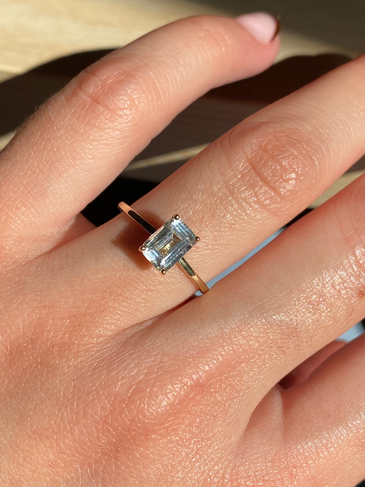 EMERALD CUT WHITE TOPAZ SOLITAIRE RING