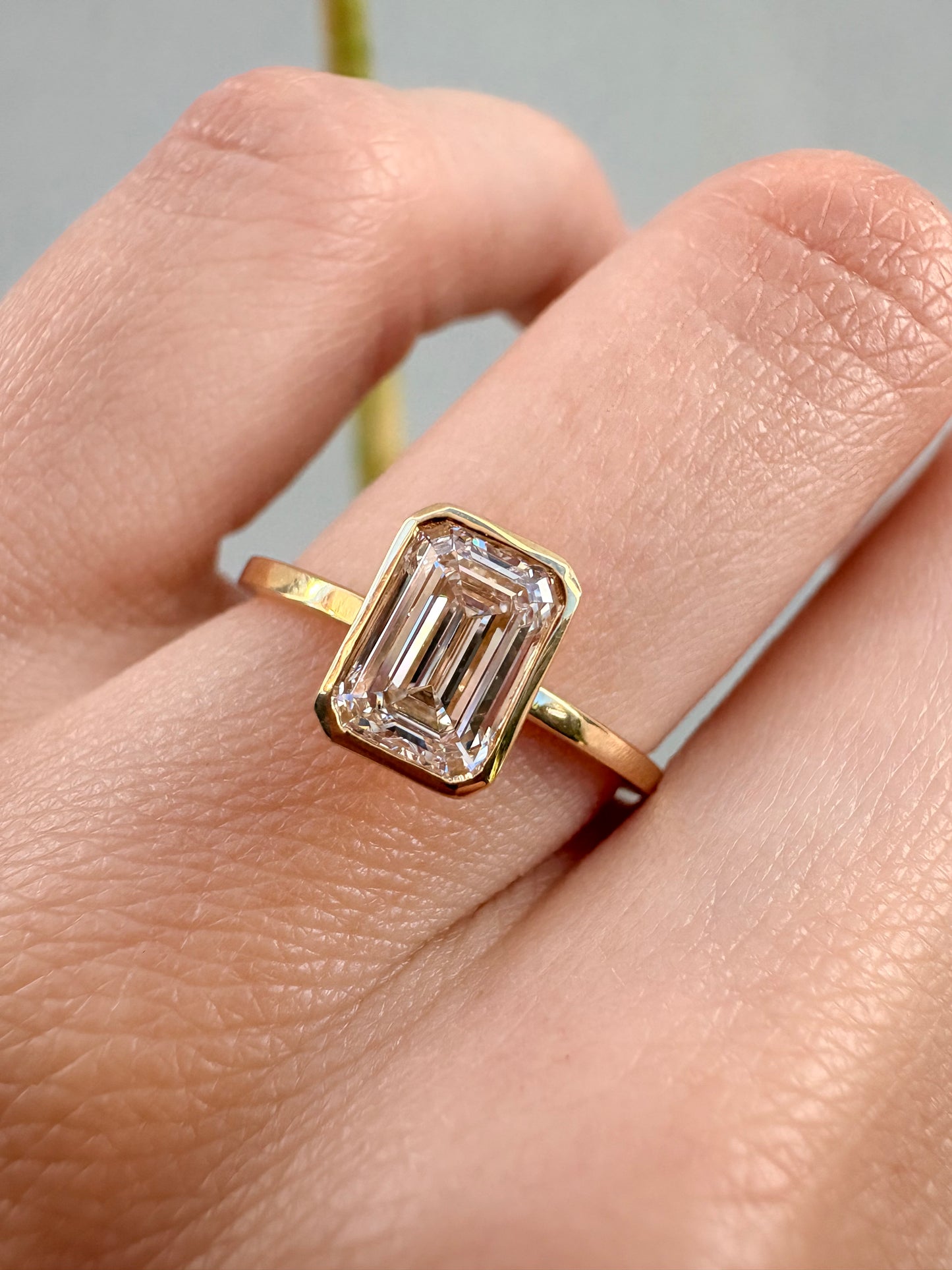 EMERALD CUT BEZEL SOLITAIRE RING
