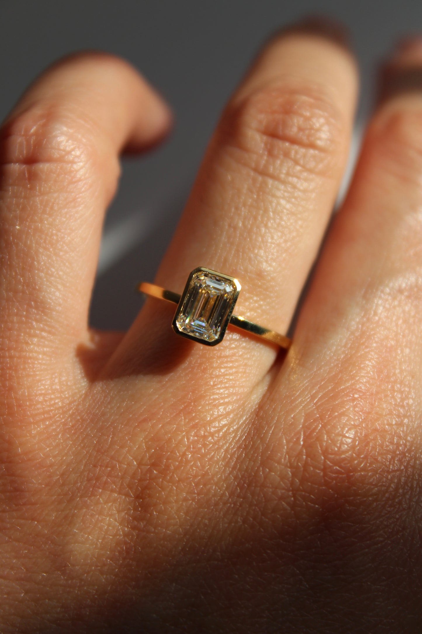EMERALD CUT BEZEL SOLITAIRE RING